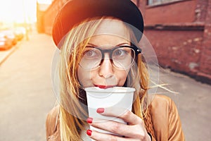 Stylish woman drinking coffee