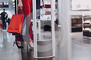 Stylish woman is entering duty free boutique