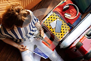 Stylish woman with French flag and Eiffel tower souvenir