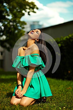 Stylish woman girl on casual green dress