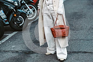 Stylish woman with handbag on street