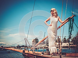 Stylish woman on a luxury regatta