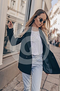 Stylish fashion girl posing in the street photo
