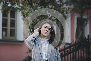 Stylish woman posing on the street