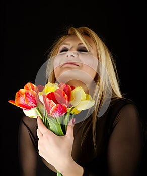 Stylish Woman with red and yellow tulips