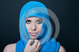 Stylish woman with smooth skin posing with burka