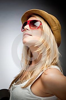 Stylish woman in sunglasses and a hat