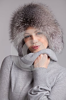 Stylish woman in winter fur hat