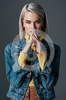 stylish woman in yellow turtleneck and jeans jacket