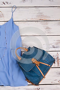 Stylish women blouse and bagpack. photo