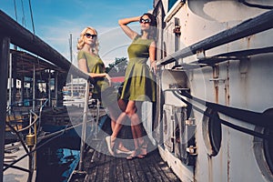 Stylish women on old boat