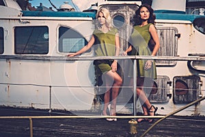 Stylish women on old boat