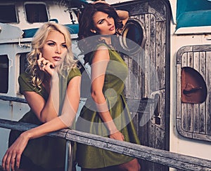 Stylish women on old boat