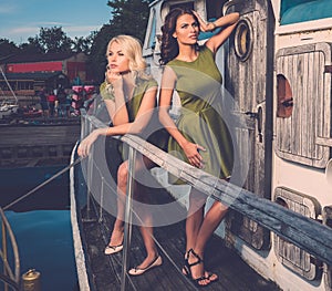 Stylish women on old boat