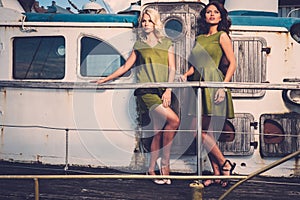 Stylish women on old boat