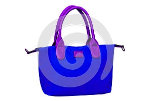 Stylish women's handbag. A fashionable female blue luxury handbag with brown leather handles isolated on white. Clippin