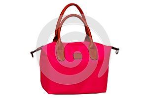 Stylish women's handbag. A fashionable female red luxury handbag with brown leather handles isolated on white. Fashionable