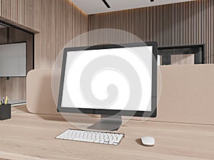 Stylish wooden office interior with pc computer mockup screen on table