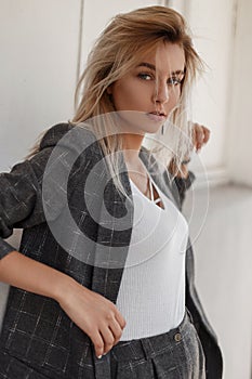 Stylish young beautiful model woman with a shrewd gaze