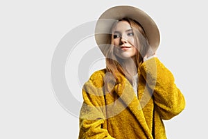 Stylish young beautiful woman wearing coat and hat