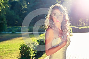 Stylish Young Bride Outdoors at Nature Background.