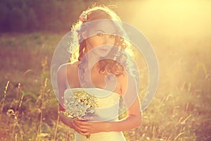 Stylish Young Bride Outdoors at Sunset