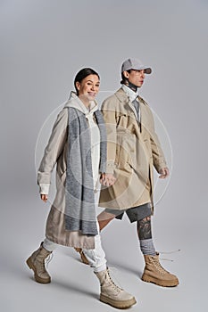 A stylish young couple, dressed in