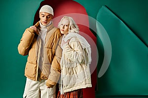 stylish young couple in white winter