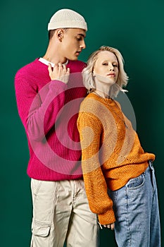 stylish young couple in winter sweaters