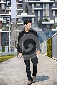 Stylish Young Handsome Man in Black Coat Standing in City Center