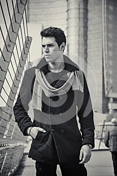 Stylish Young Handsome Man in Black Coat Standing in City Center Street