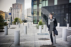 Stylish Young Handsome Man in Black Coat Standing