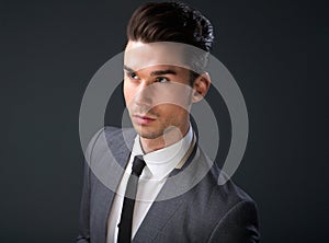 Stylish young man in business suit and tie