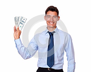 Stylish young man holding cash dolllars