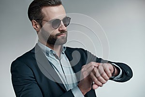 Stylish young man in a suit and bow tie. Business style. Fashionable image.