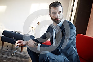 Stylish young man in a suit and bow tie. Business style. Fashionable image.