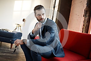 Stylish young man in a suit and bow tie. Business style. Fashionable image.