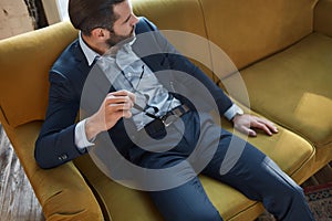 Stylish young man in a suit and bow tie. Business style. Fashionable image. Evening dress.