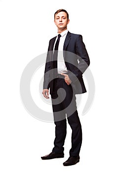 Stylish young man in suit and tie. Business style. Handsome man standing and looking at the camera