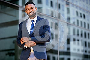 Stylish young modern business entrepreneur CEO, corporate executive in suit and tie in urban setting