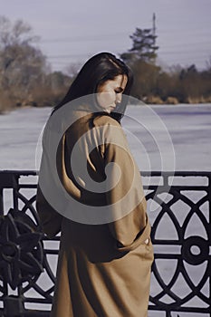 Stylish young woman out for a walk. she dressed and looks very fashionable.