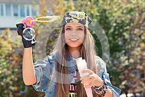 Stylish young woman with soap bubbles