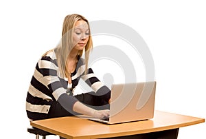 Stylish young woman working on a laptop