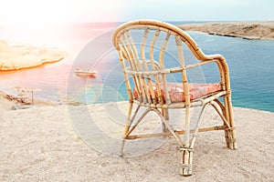 Stylishly beautiful chair on the sea nature landscape background