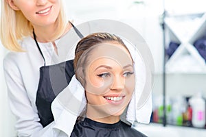 Stylist is drying off clients hair