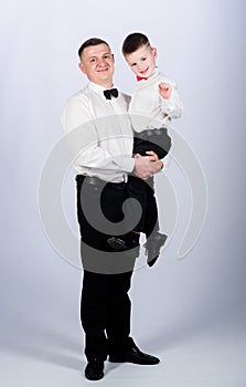 Stylist in tuxedo style. Wedding party. father and son in formal suit. happy child with father. business meeting. small