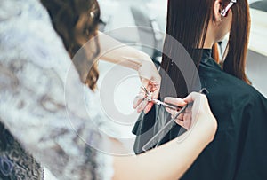 Stylist working in the beauty salon, haircut and hair styling photo