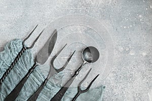 Stylized cutlery on concrete background above