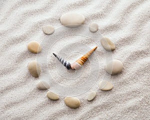 Stylized dial clock for shells on the sand for concentration and relaxation for harmony and balance in pure simplicity