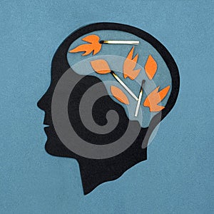 Stylized head silhouette. Symbolic image of pyromania